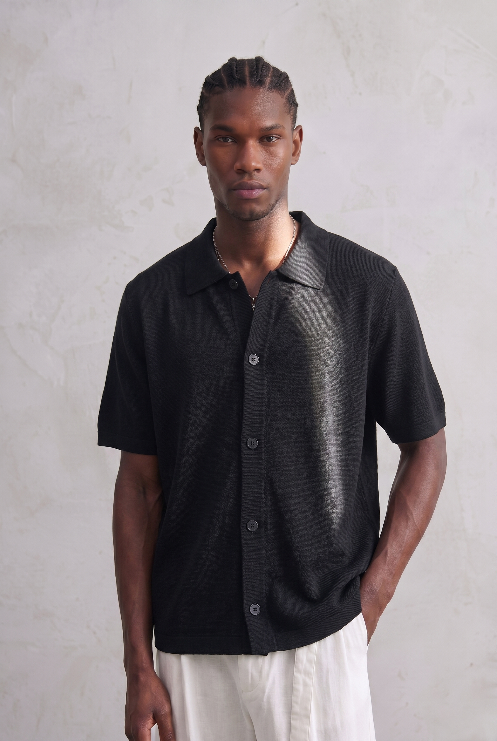 Polo boutonné en maille légère – Noir